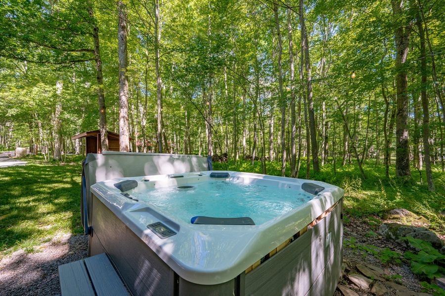 Private outdoor hot tub in the trees