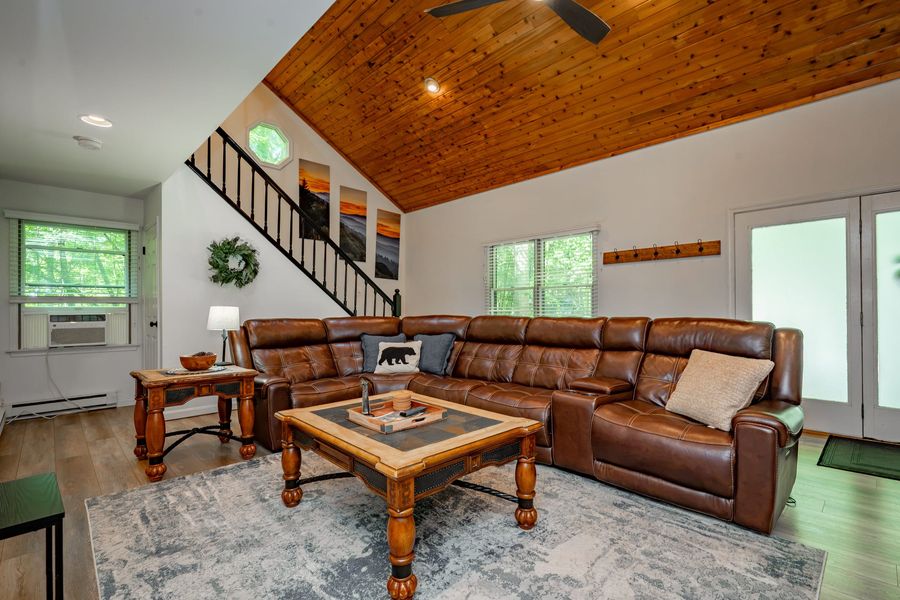 Living room with vaulted ceiling and leather sectional